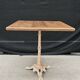 Bistro table with cast iron base and solid teak top