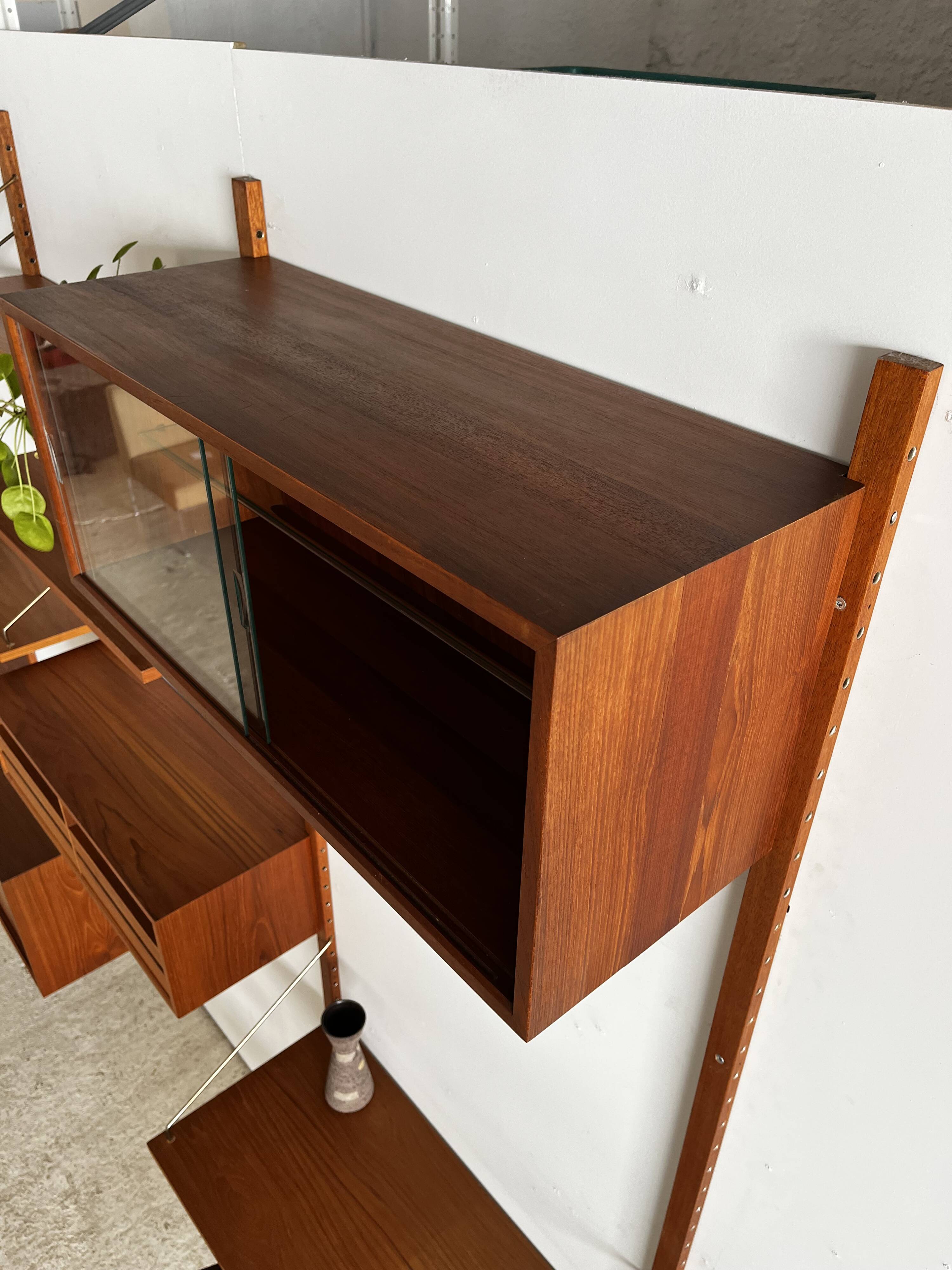 A wall unit with 4 compartments by Poul Cadovius, Denmark, 1960s.