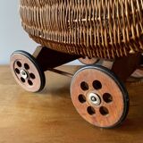 Old wicker dolls' pram - wooden wheels