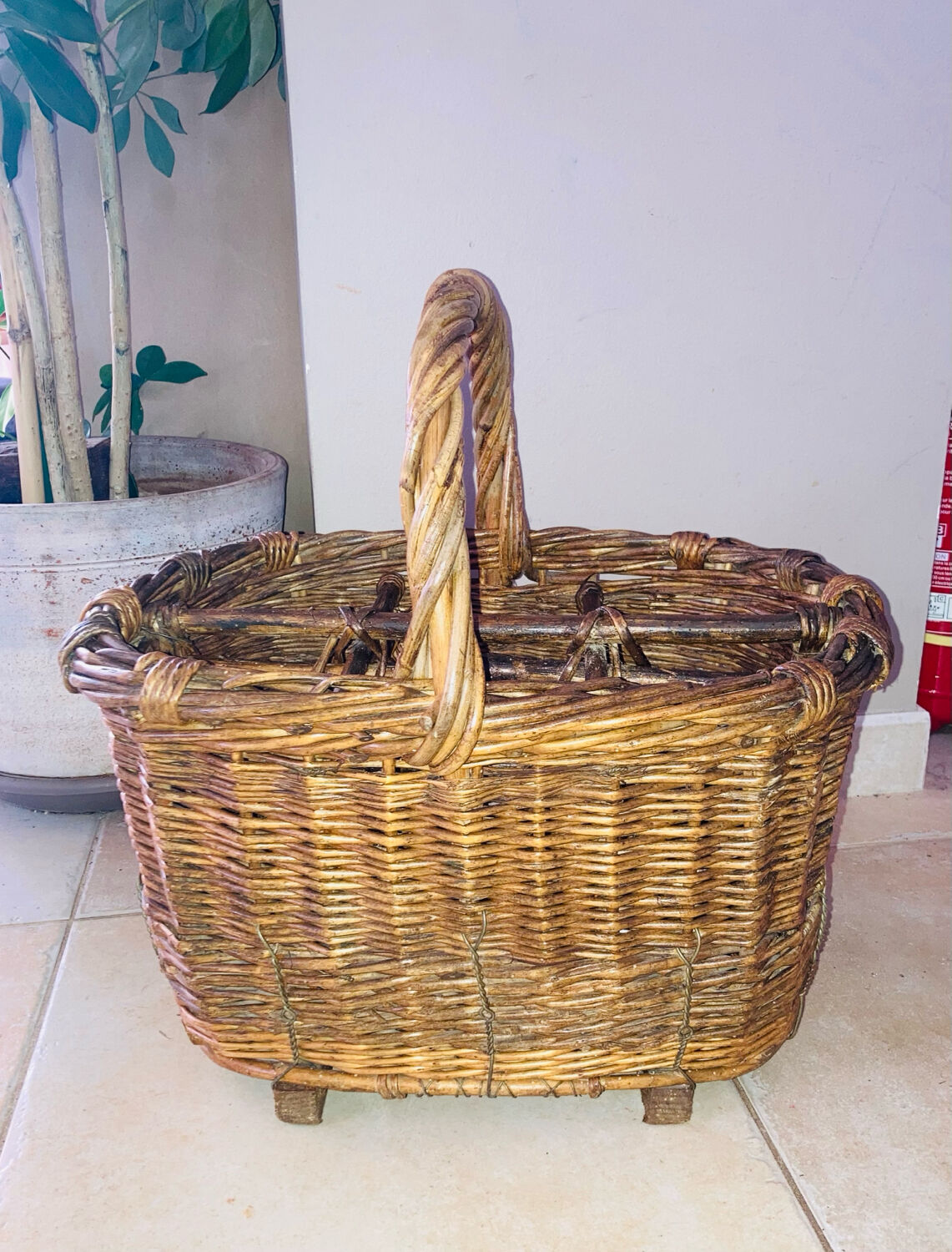 Wicker and hazel bottle basket from the early 20th century or possibly earlier.