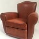 Large club chair in cognac leather