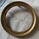 Small round frame in old gilded wood
