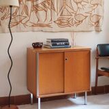 1970s low furniture in wood and metal with sliding doors.