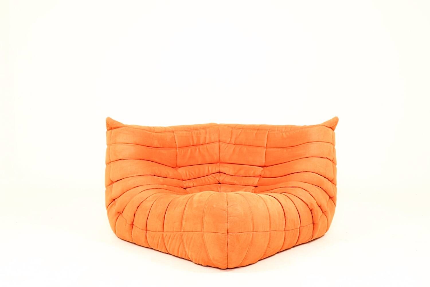 Togo sofa set and armchairs in pumpkin orange, 3 pieces, no label.