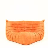 Togo sofa set and armchairs in pumpkin orange, 3 pieces, no label.