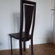 Set of 6 wooden chairs covered in leather.
