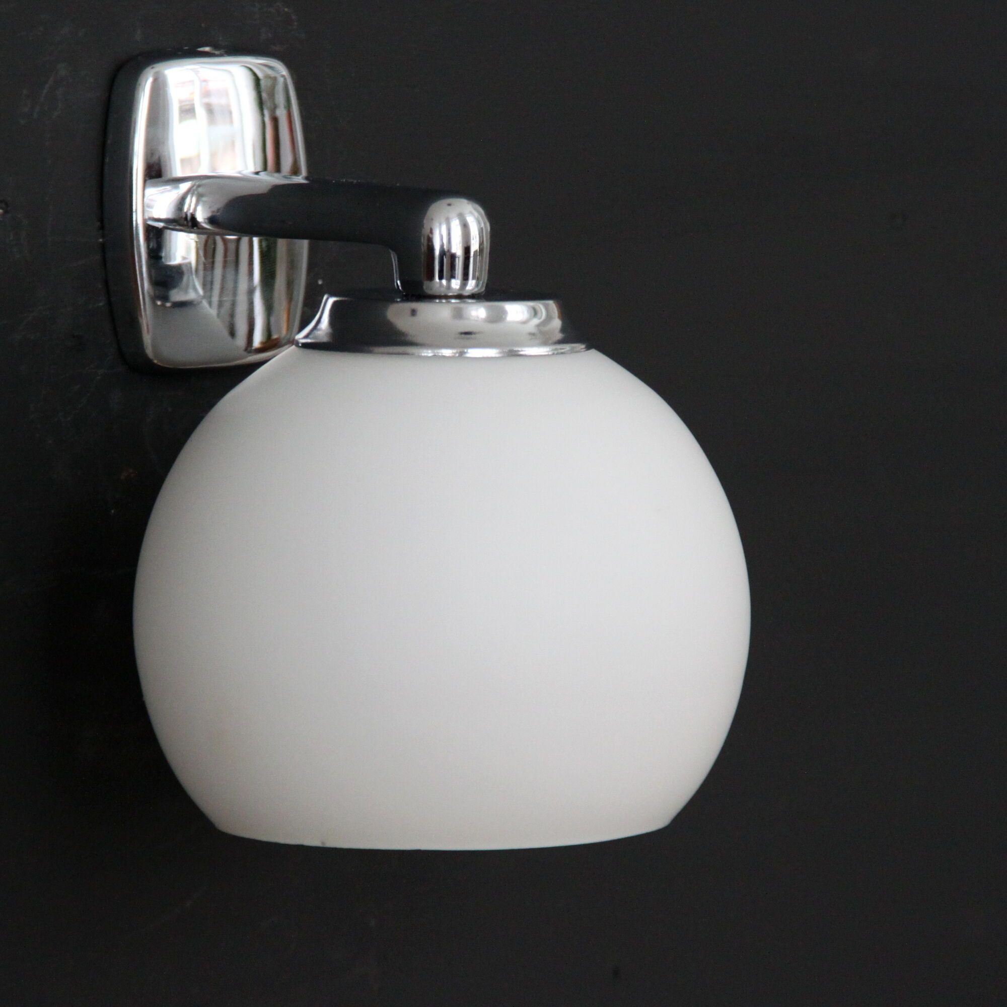 Pair of stainless steel and white glass wall sconces, seventies