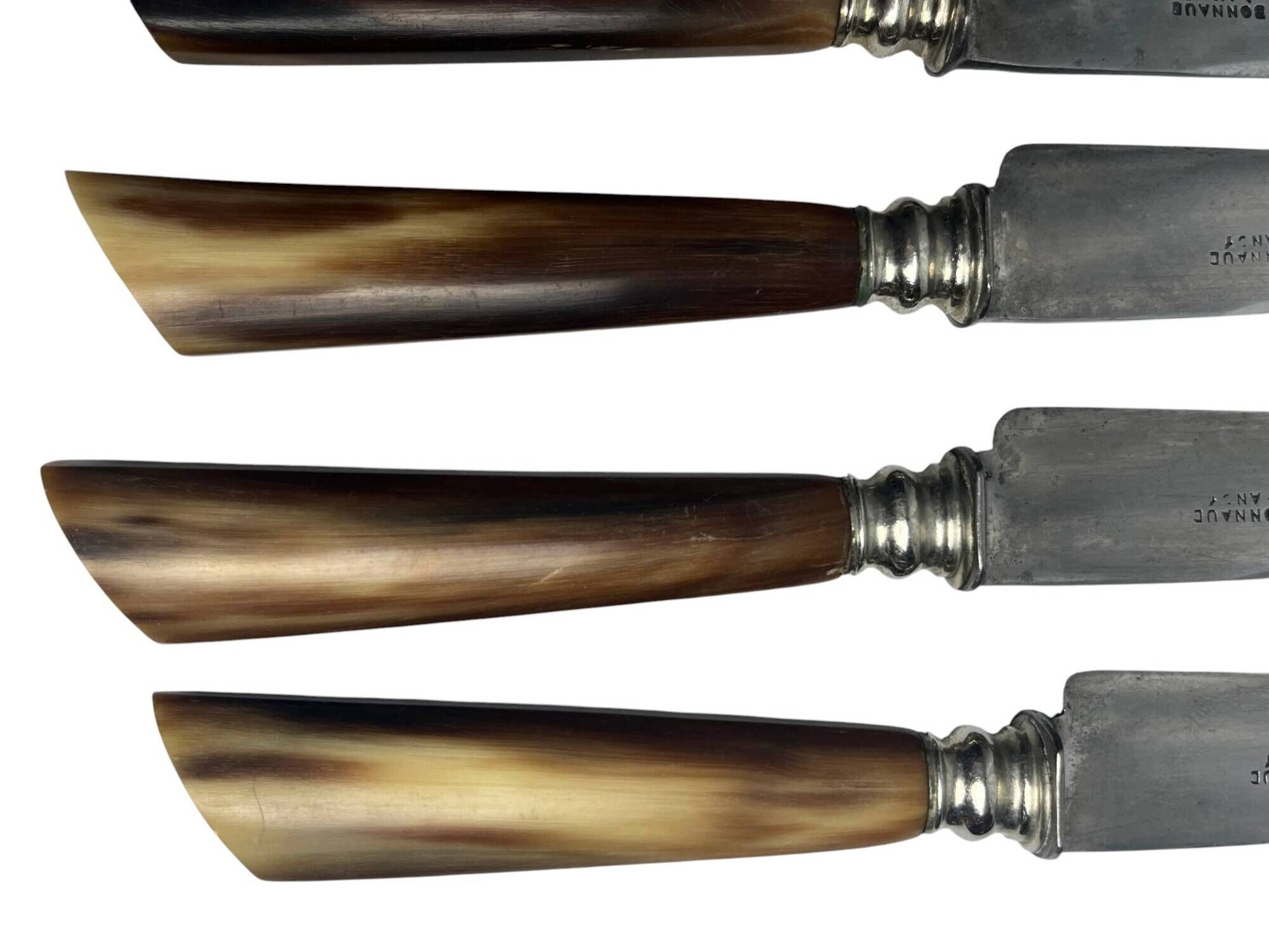 Six knives with steel blades and horn handles, Bonnaud Nancy, early 20th century.
