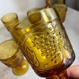 Six stemmed glasses in amber-colored molded glass
