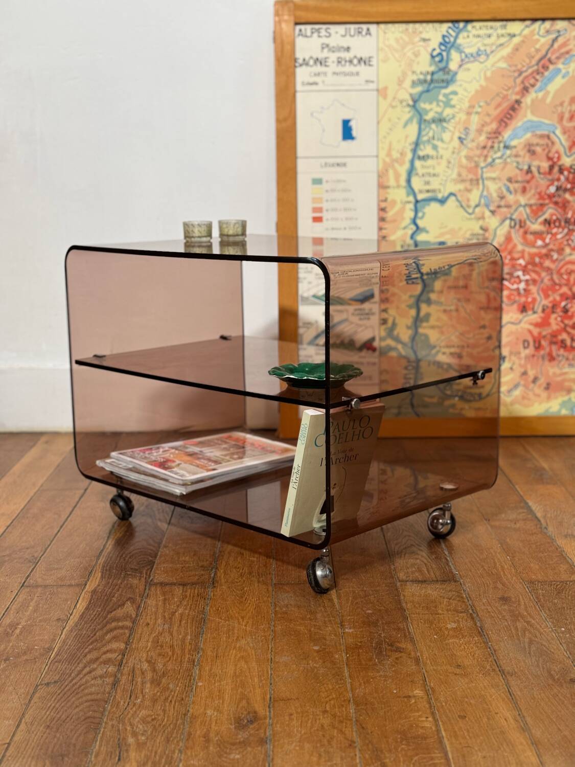 Smoked Plexiglas coffee table on wheels -