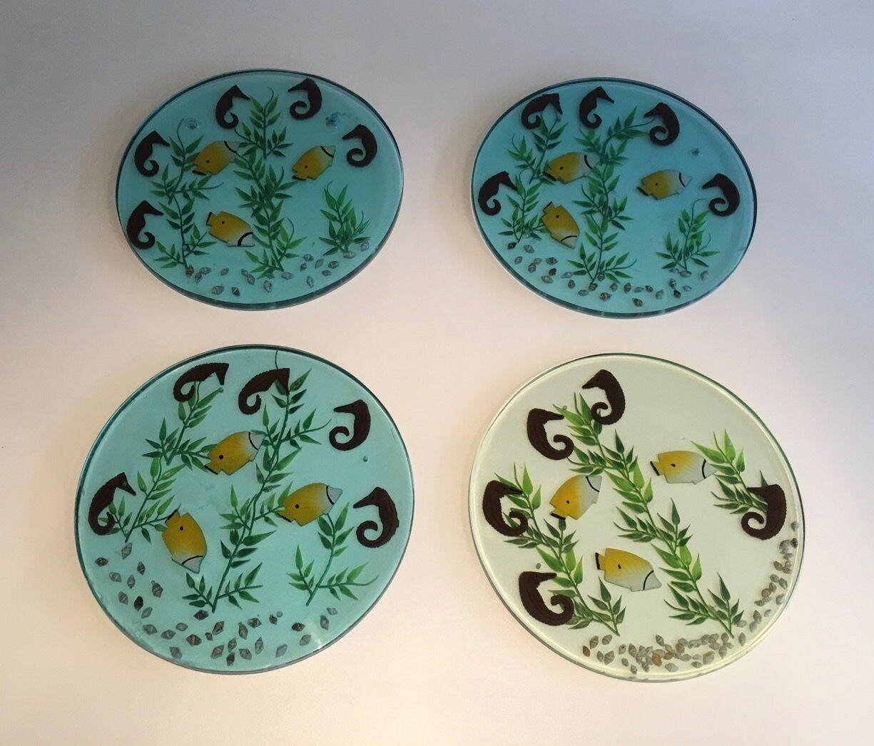 Set of 4 resin trays, inlaid with seahorses, fish, seaweed, and shells.