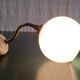 Swan neck wall lamp in gilded brass and opaline globe - mid-20th century