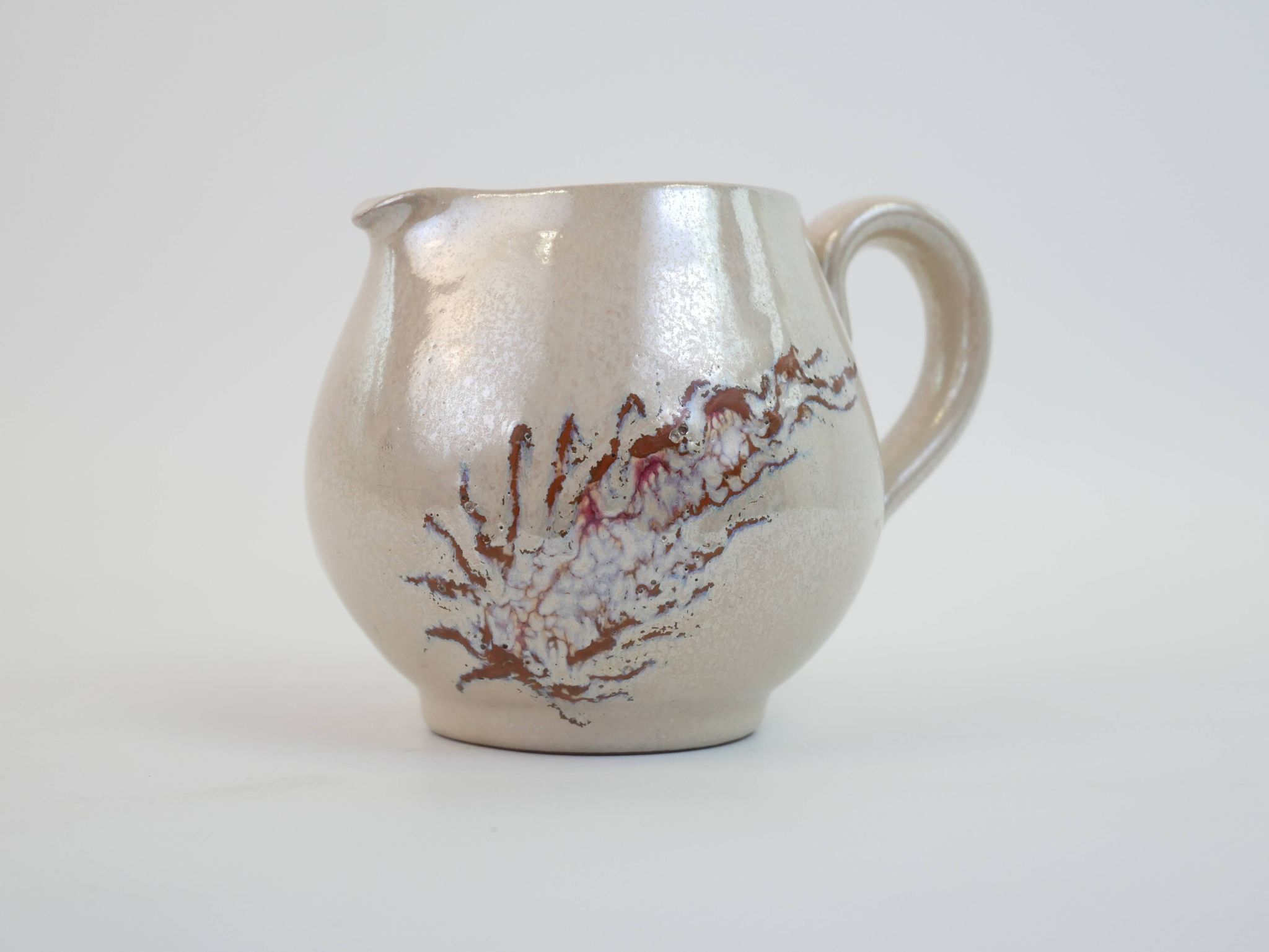 Pair of ceramic milk jugs signed La Roue Vallauris