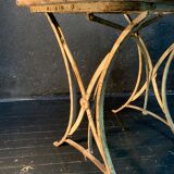 Ancient wrought iron and wood garden table