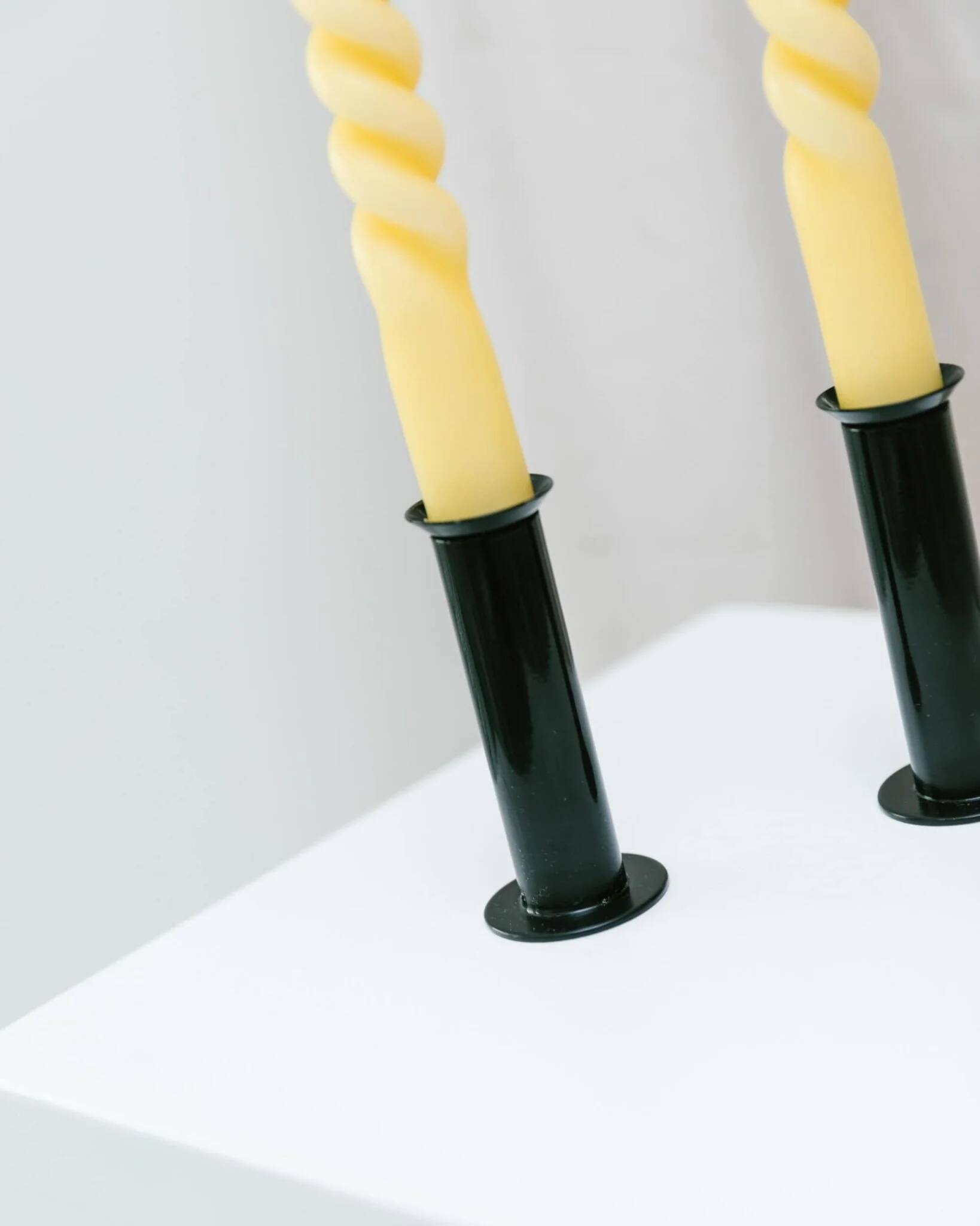 Set of 2 glossy black metal candleholders in retro Ikea Memphis style