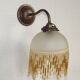 French vintage bronze effect single wall light with opaque beaded glass shade.