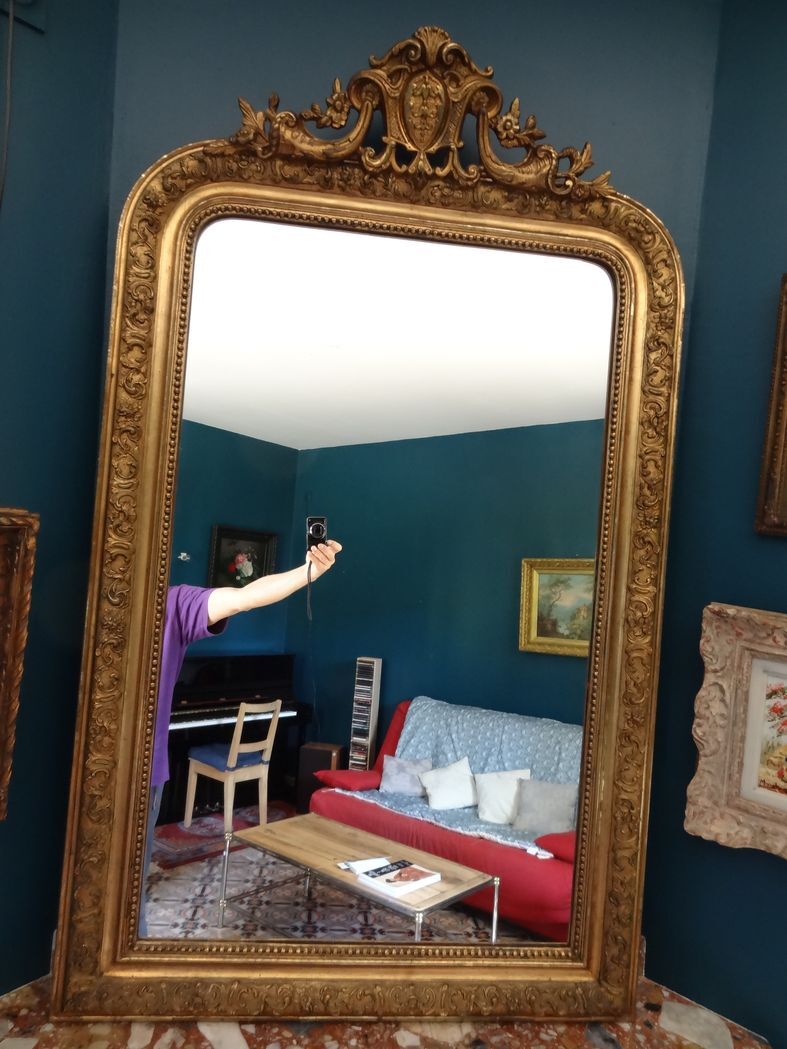 Mirror XIXth in gilded stucco, H 142 cm