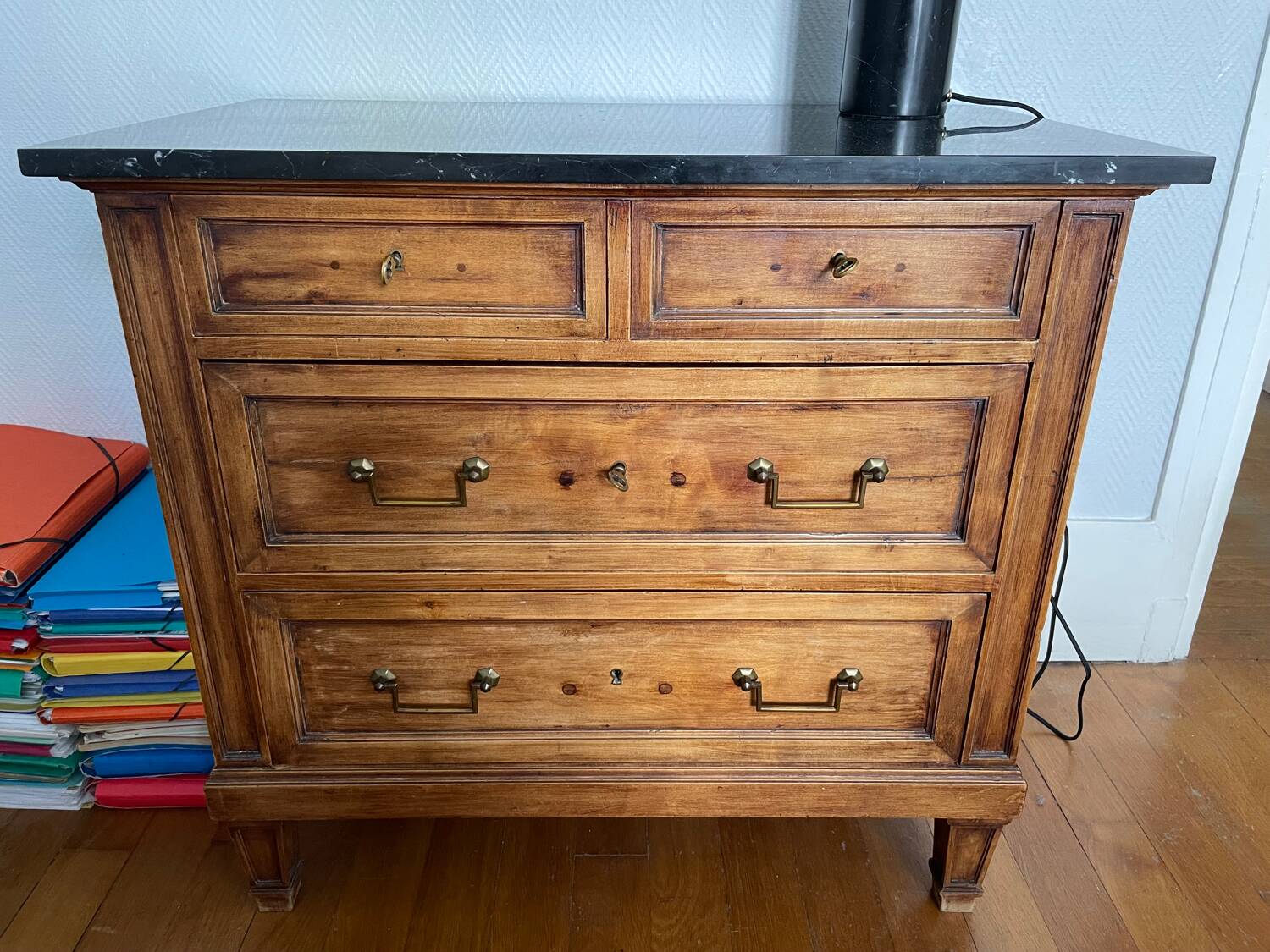 Antique wooden order with black marble top