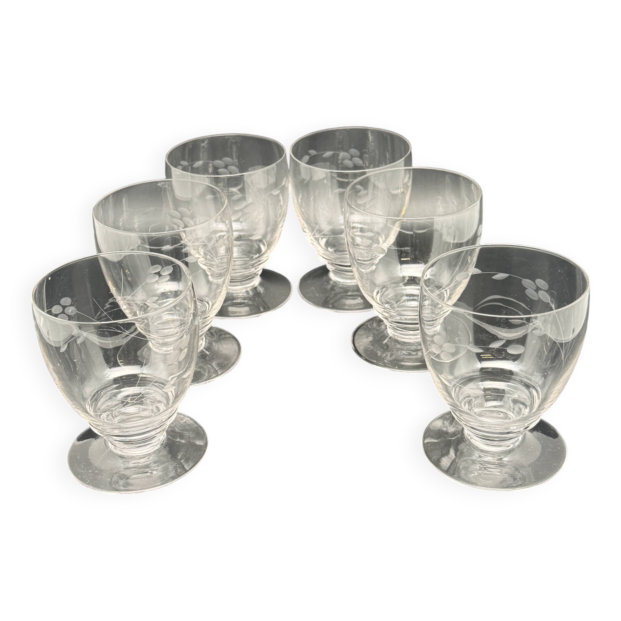 Set of fine glass stemmed glasses with small flower patterns