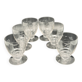 Set of fine glass stemmed glasses with small flower patterns