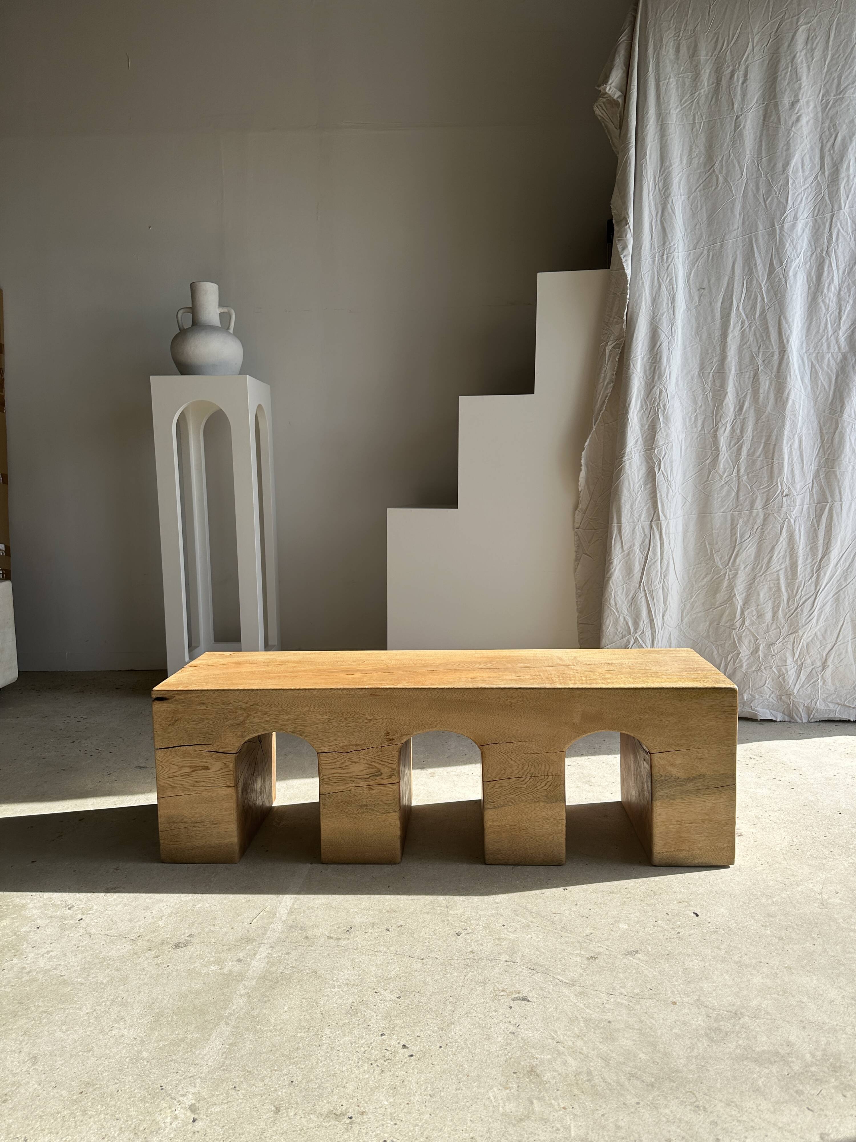 Solid monoxyl wood bench with carved 3-arch base - Natural wood color