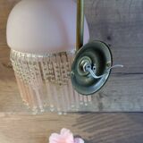 Brass swan neck wall lamp with pink glass globe and Charleston tassels