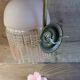 Brass swan neck wall lamp with pink glass globe and Charleston tassels
