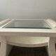Table basse vintage en travertin et verre biseauté