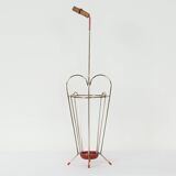 VINTAGE UMBRELLA STAND OF CURVED METAL, RED DETAILS AND A BAMBOO HANDLE, 1950S
