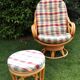 Swivel rattan armchair with matching ottoman