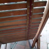 Teak stretchy long chair.