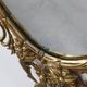 Miroir ovale en métal doré de style rococo, Italie, 20e siècle