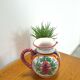 Porseleinen vintage roze kan met bloemen