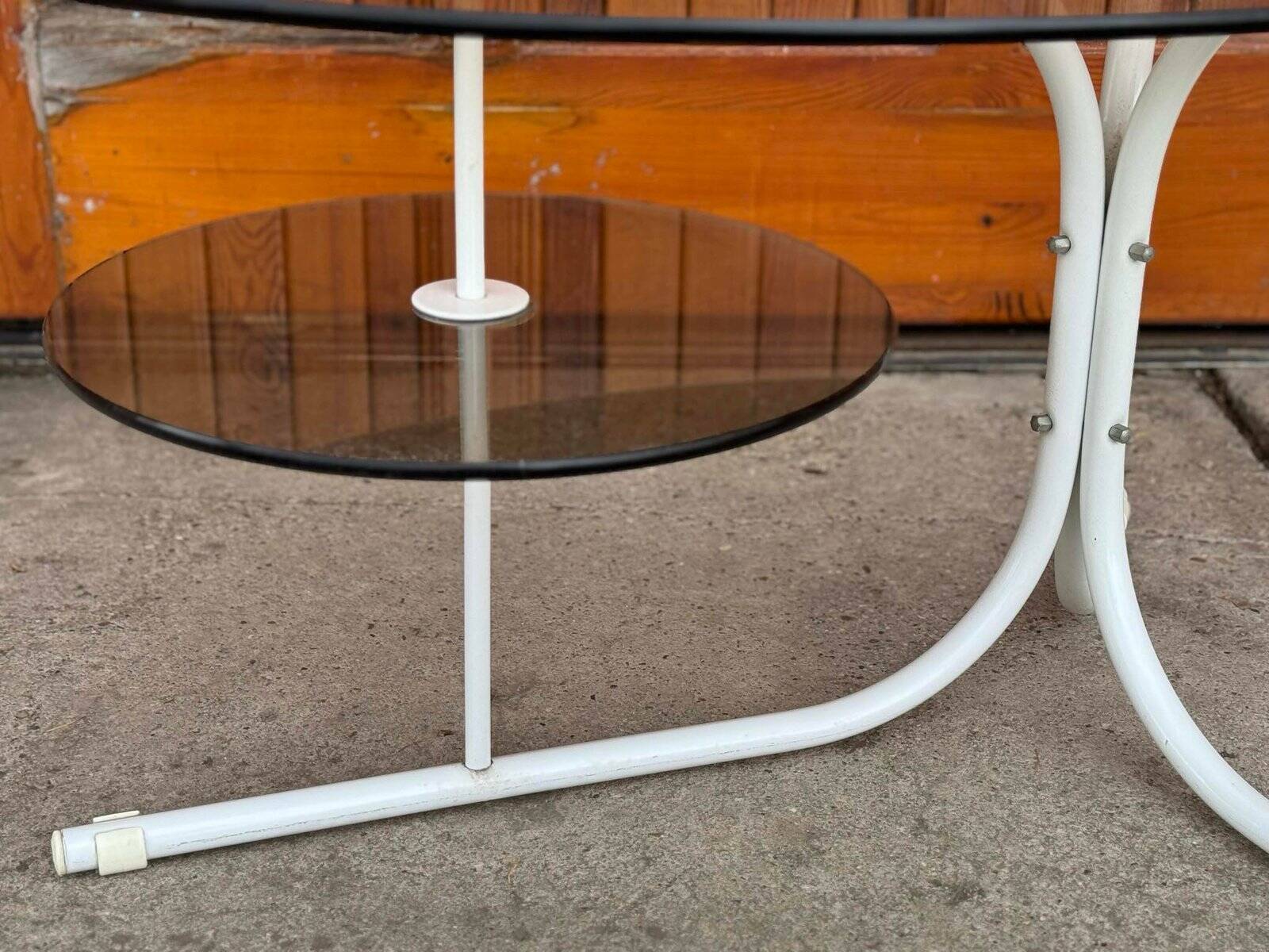 Oval smoked grey glass coffee table with white metal legs - 1990s vintage style.