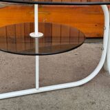 Oval smoked grey glass coffee table with white metal legs - 1990s vintage style.