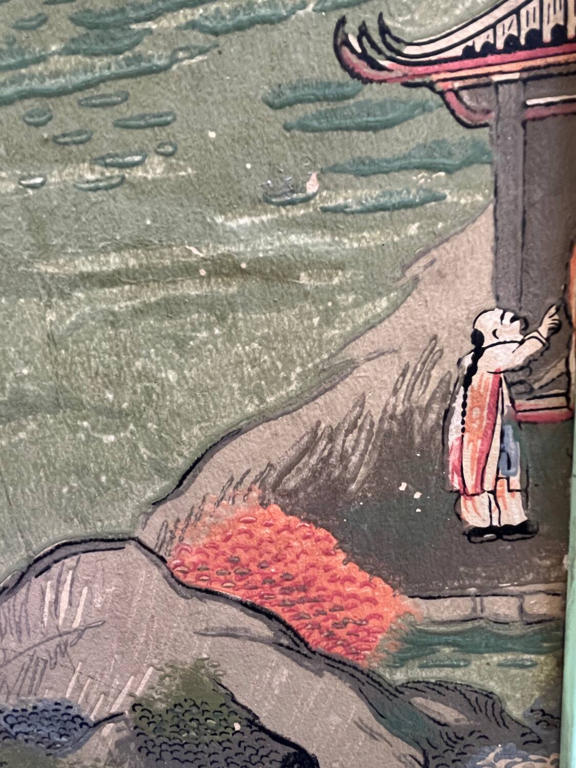 Wooden screen in Asian style, covered with Chinese wallpaper.