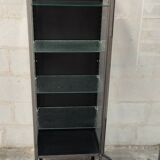 old medical display case with a graphite metal door