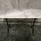 Oval bistro table in white marble with a black cast iron base - 120 cm