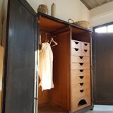 Old black wardrobe - wooden drawers and labels of origin