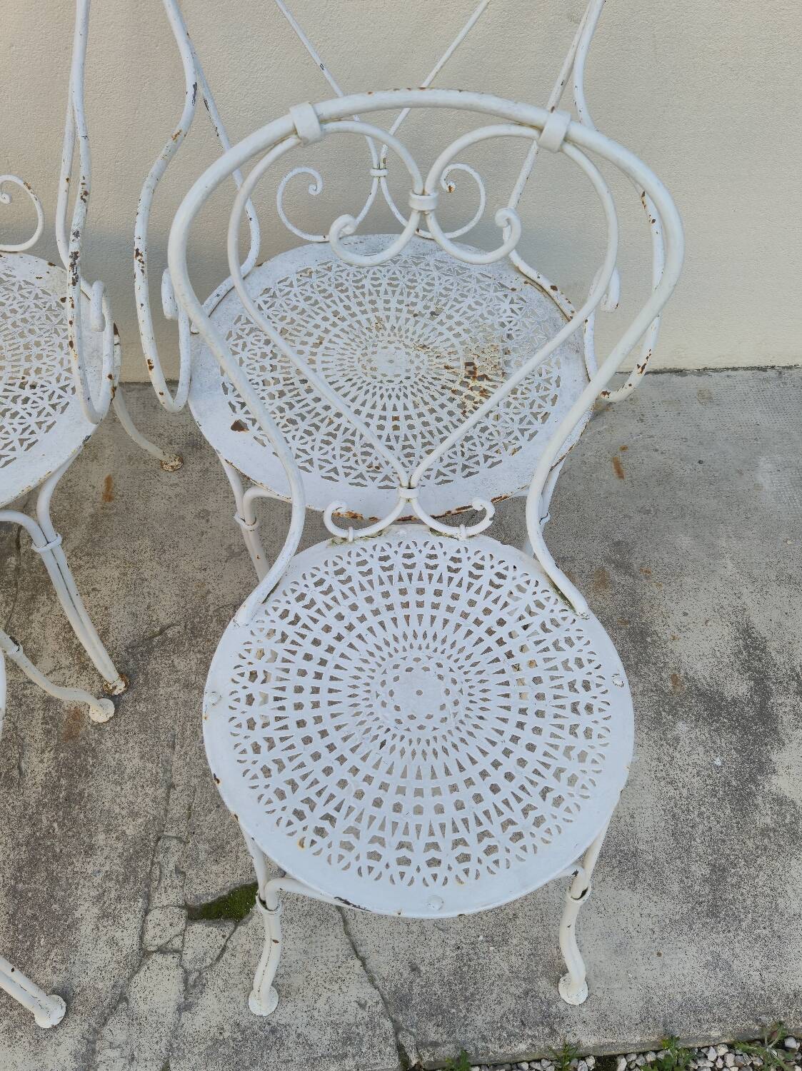 Garden furniture, two armchairs and two wrought iron chairs, period 1