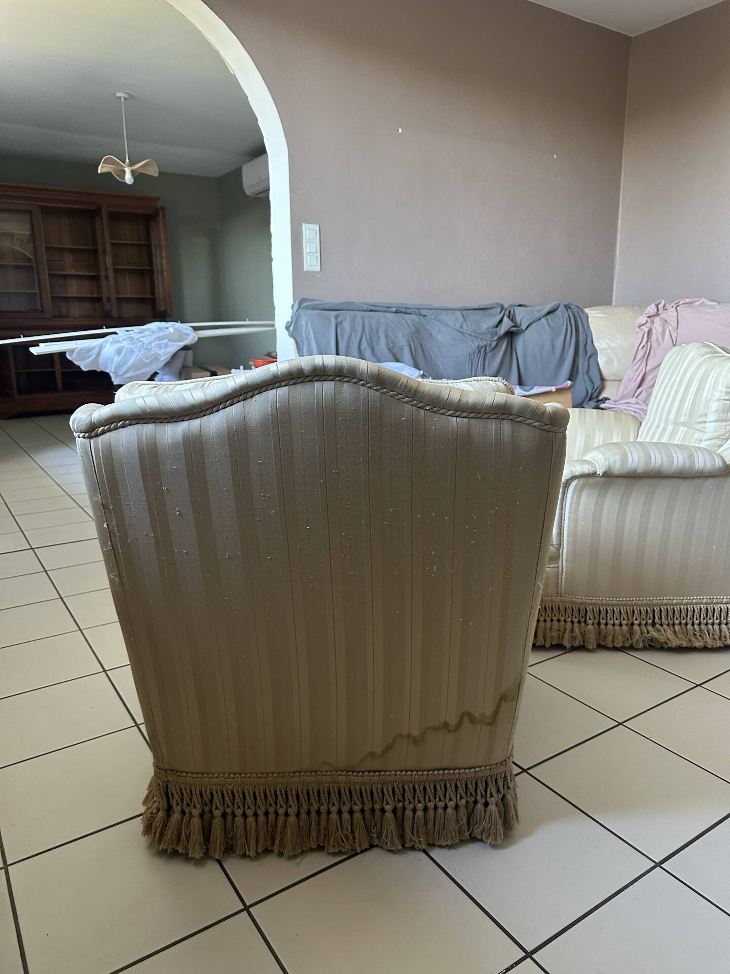 Pair of vintage bergère armchairs in striped ecru and beige fabric.