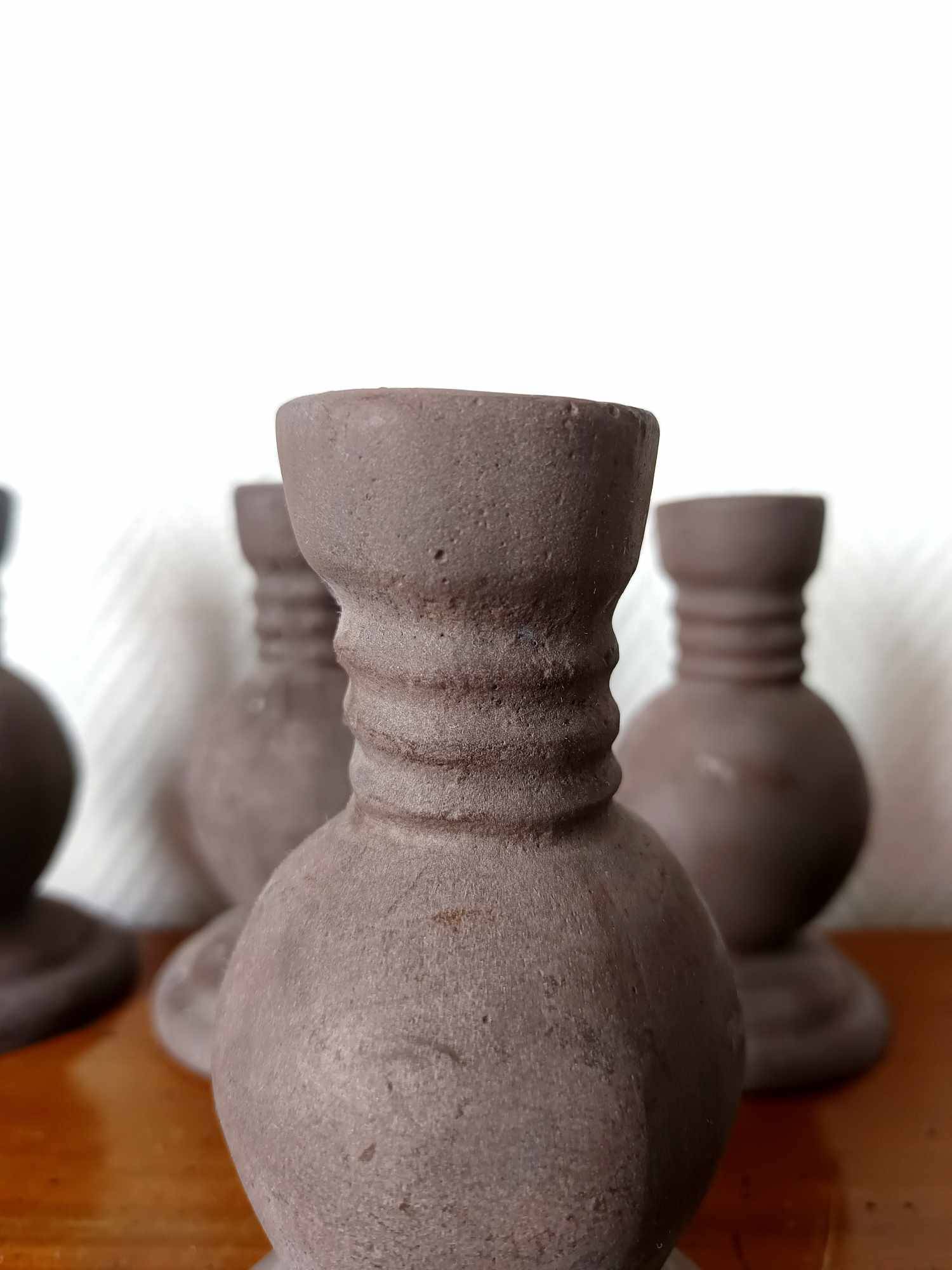Four vintage handcrafted candle holders