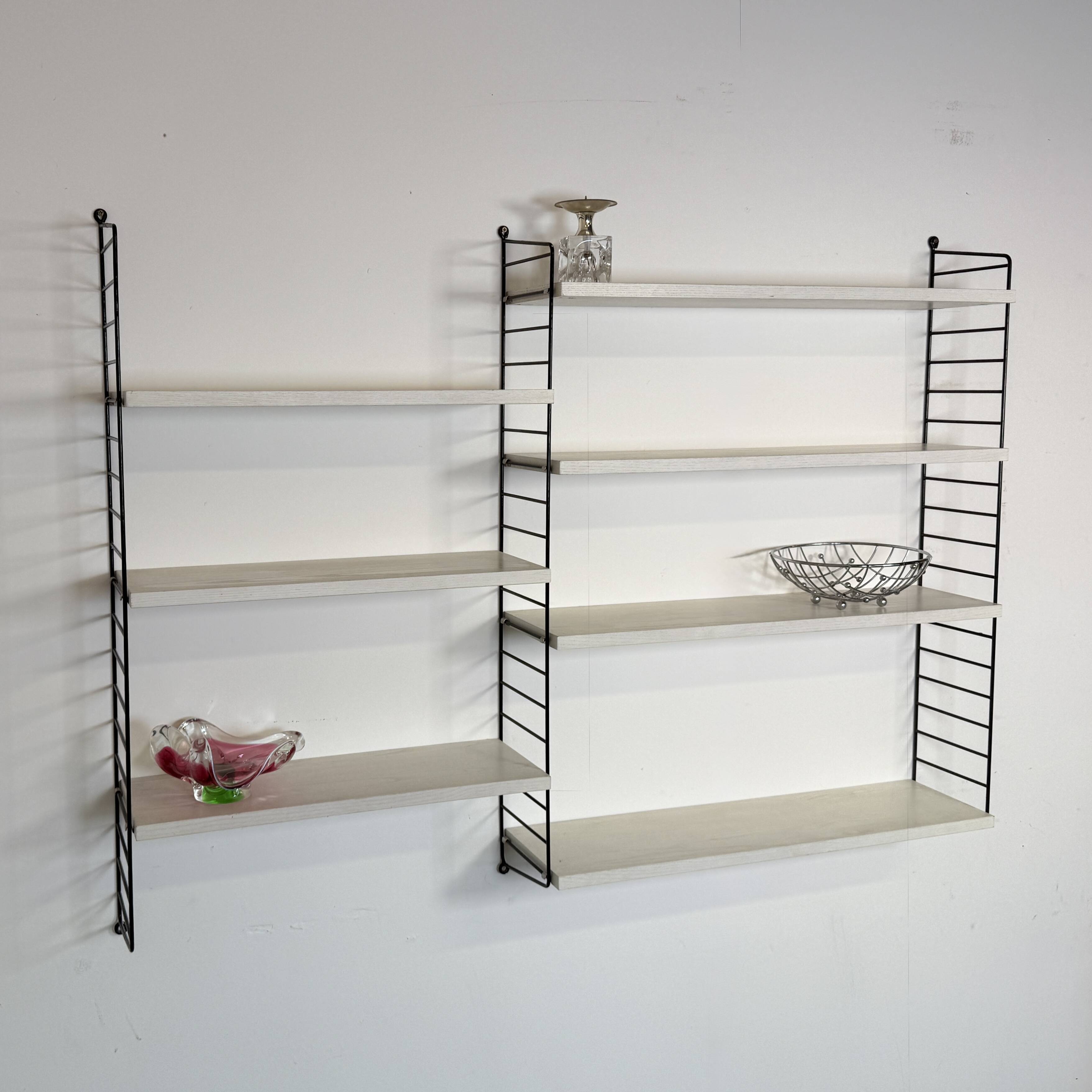 Vintage Nisse Strinning wall rack with 7 white shelves