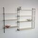 Vintage Nisse Strinning wall rack with 7 white shelves
