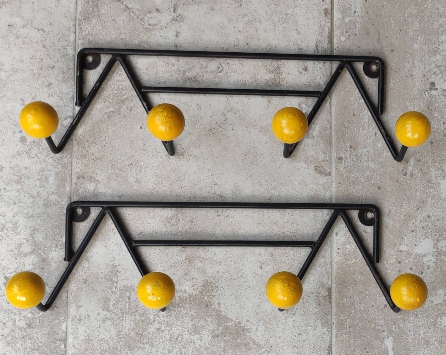 Two vintage metal and wood ball coat racks