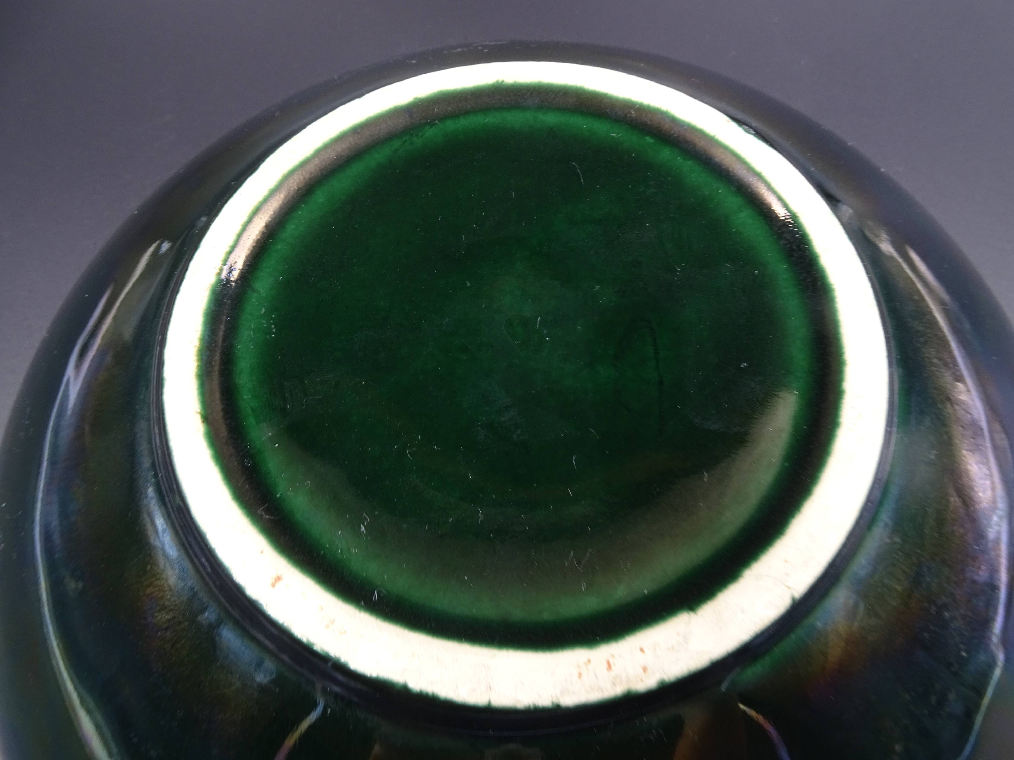 Green faience bowl decorated with multicolored drips around 1970