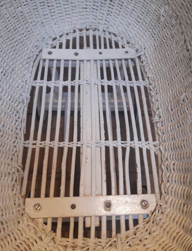 Wicker and painted wood baby cradle