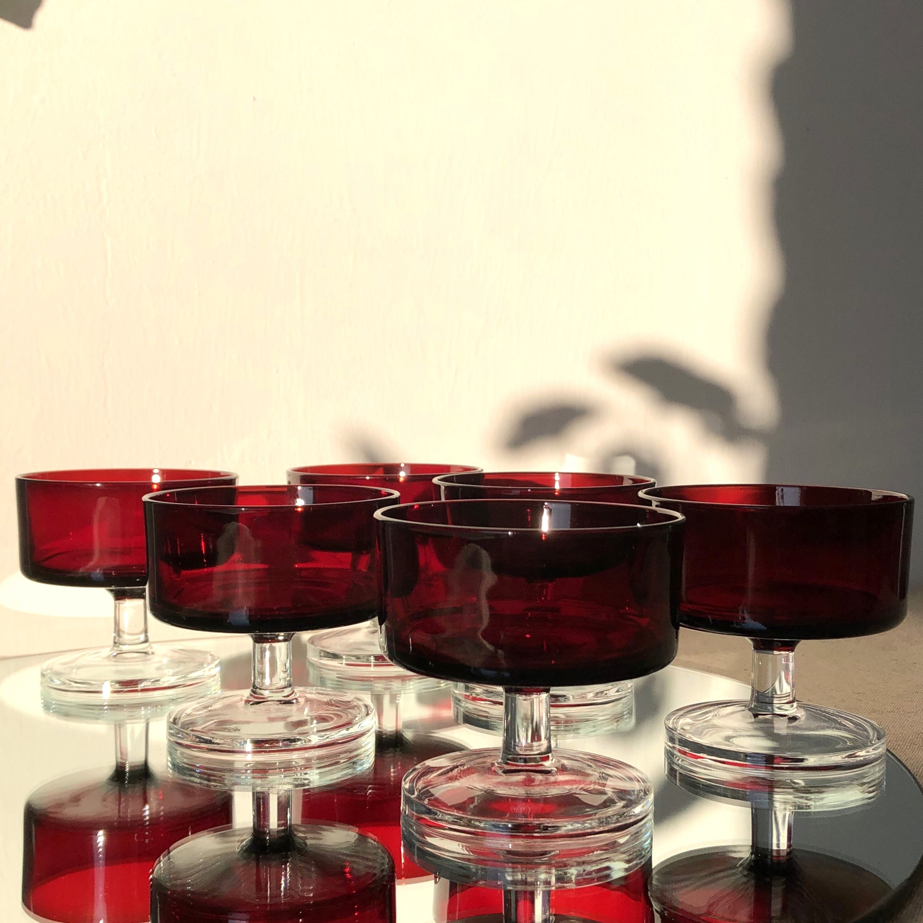 Translucent red champagne or dessert glasses, model Cavalier Luminarc 70s'.