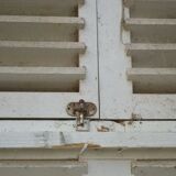 Wooden persian shutter with an opening
