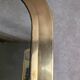 Vintage Moroccan wall mirror in brass, arch shape.
